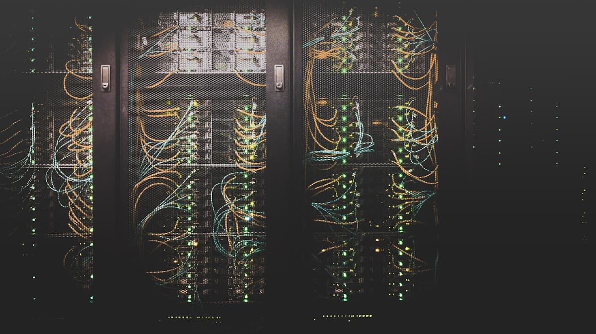Dark server racks with glowing status lights
