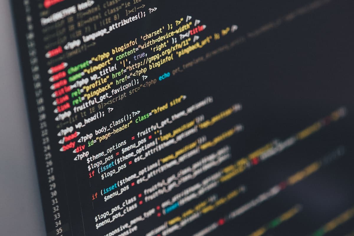 Lines of code up close on a dark screen